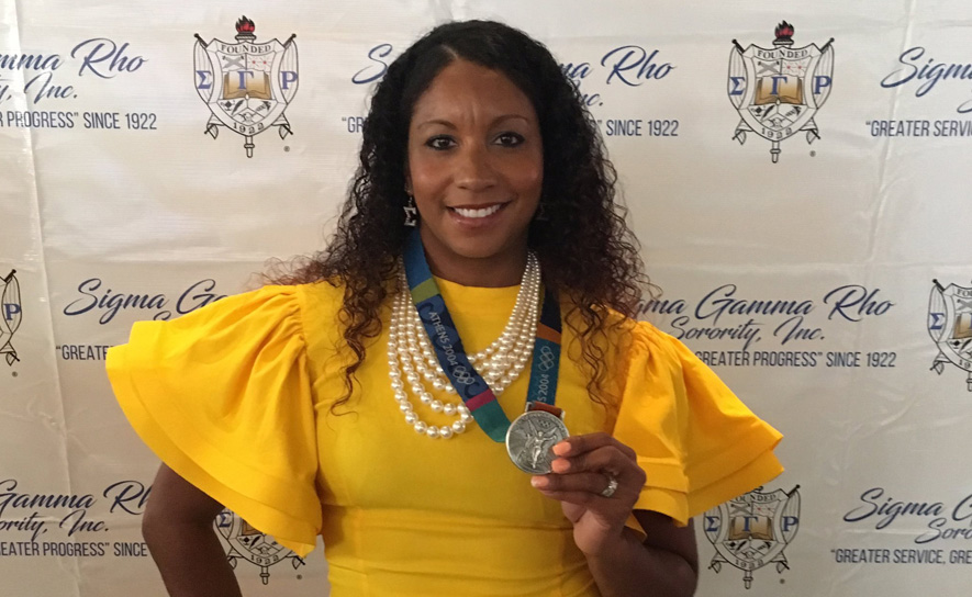 Maritza McClendon with Olympic Medal