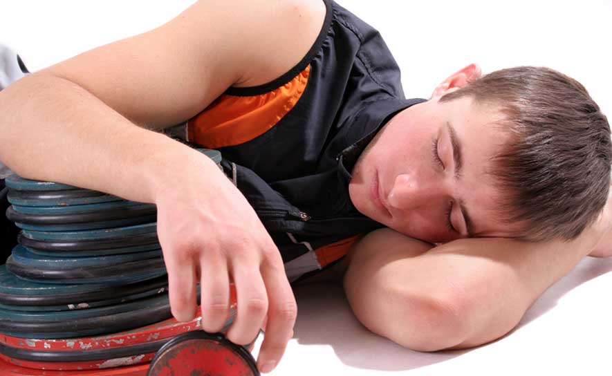 Boy Sleeping on Weights