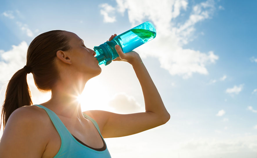 Female with Blue Water Bottle in the Sun